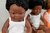Afrikaans babyjongen met het syndroom van Down (38 cm)