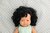 Blank babymeisje donker krullend haar (38 cm)